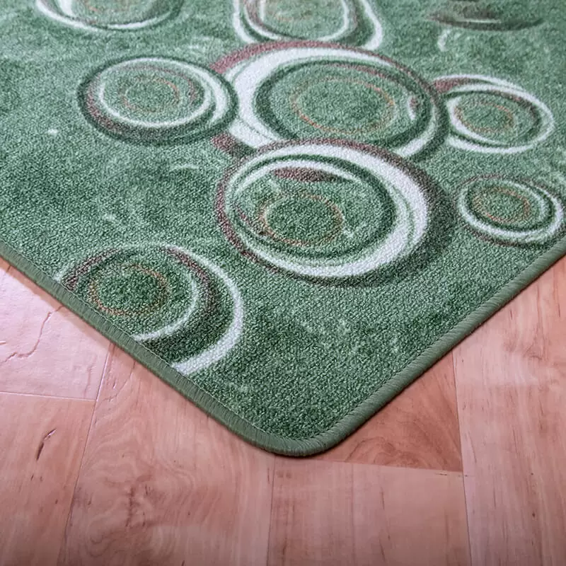 Szegett szőnyeg - Zöld színben kör mintával - sarok